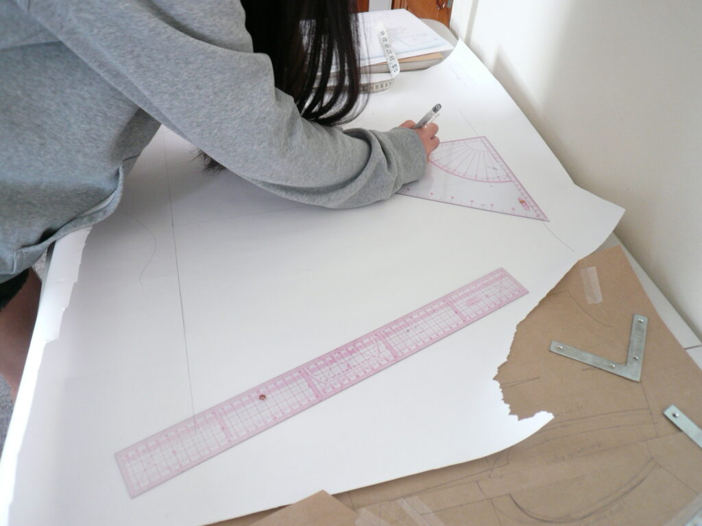 student drawing a pattern